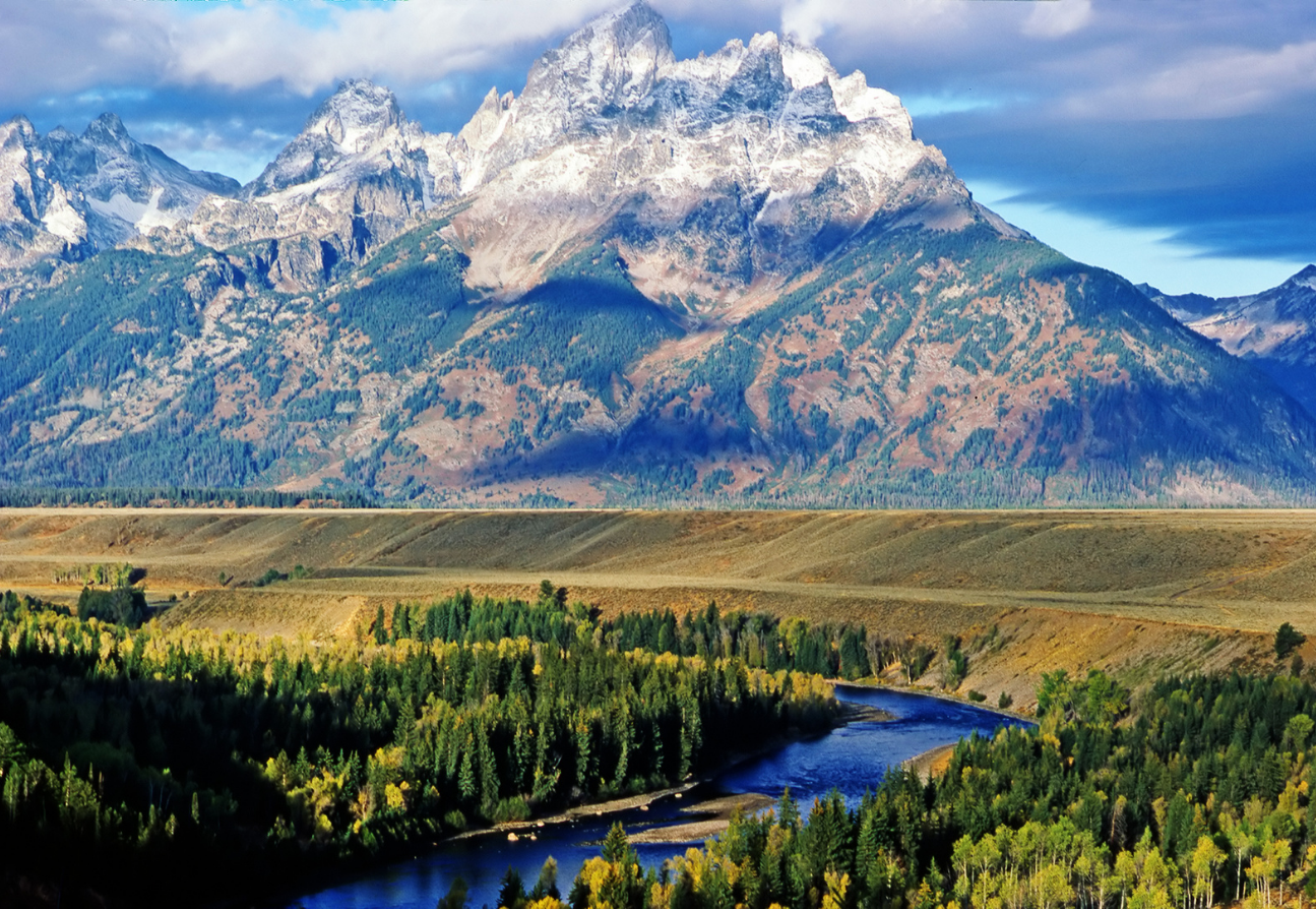 view of the snake river with mountains in the background